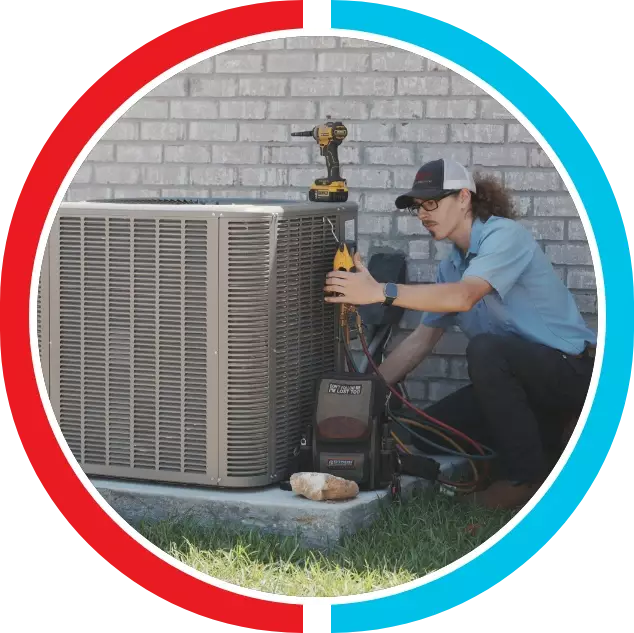 Capital City Comfort technician performing AC repair service in Slidell